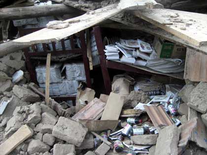Jinpa Textbooks in teh ruins of the classroom